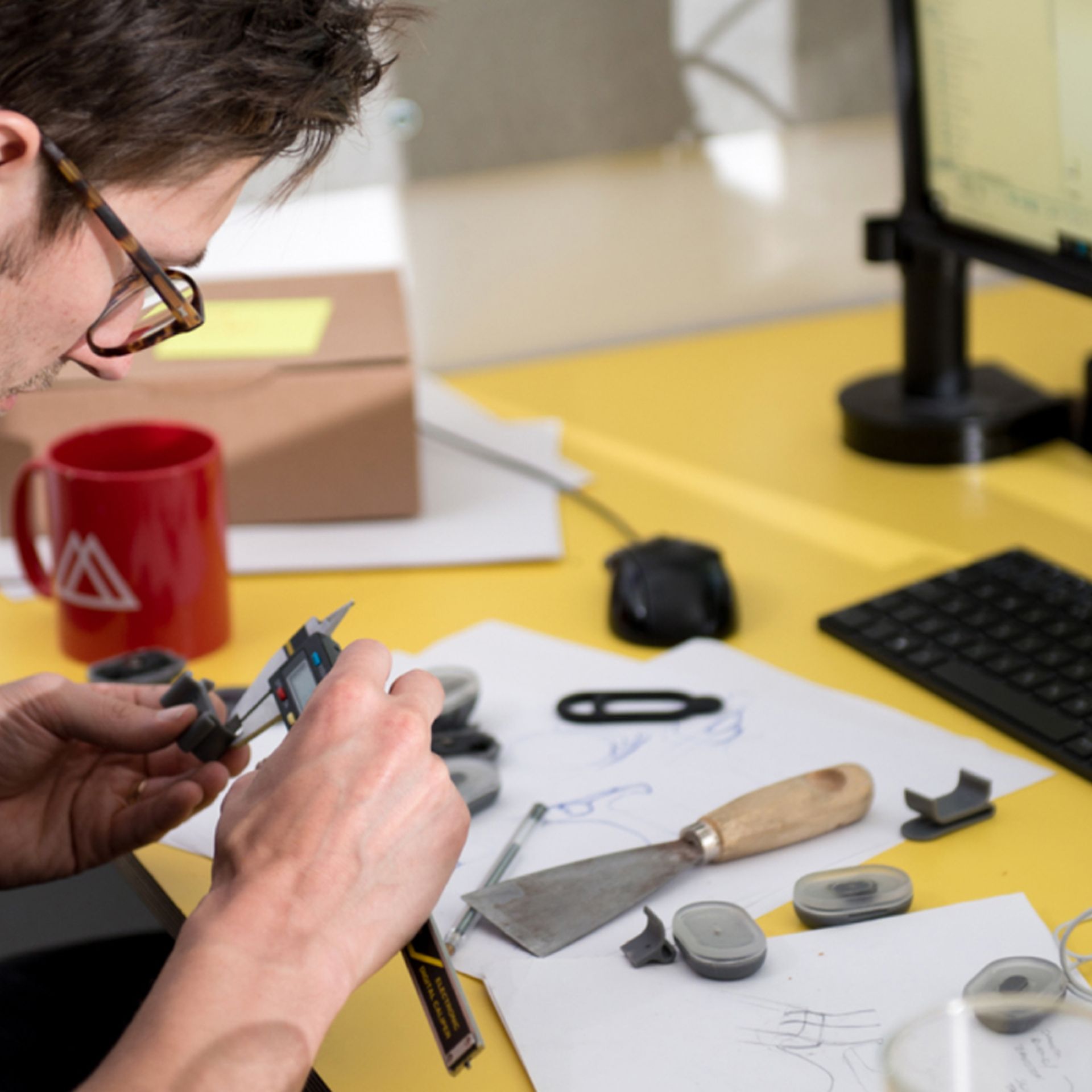 Person measuring a beryl light part