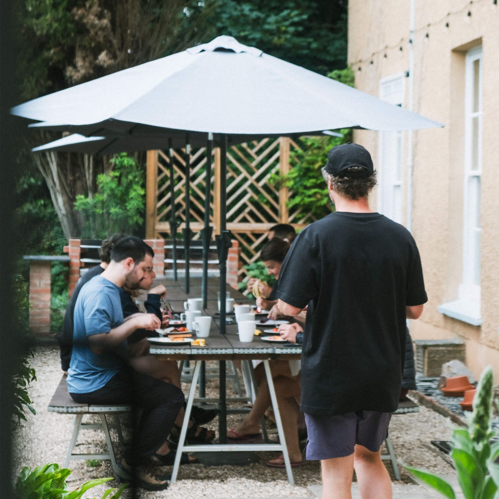 The team having breakfast together outdoors
