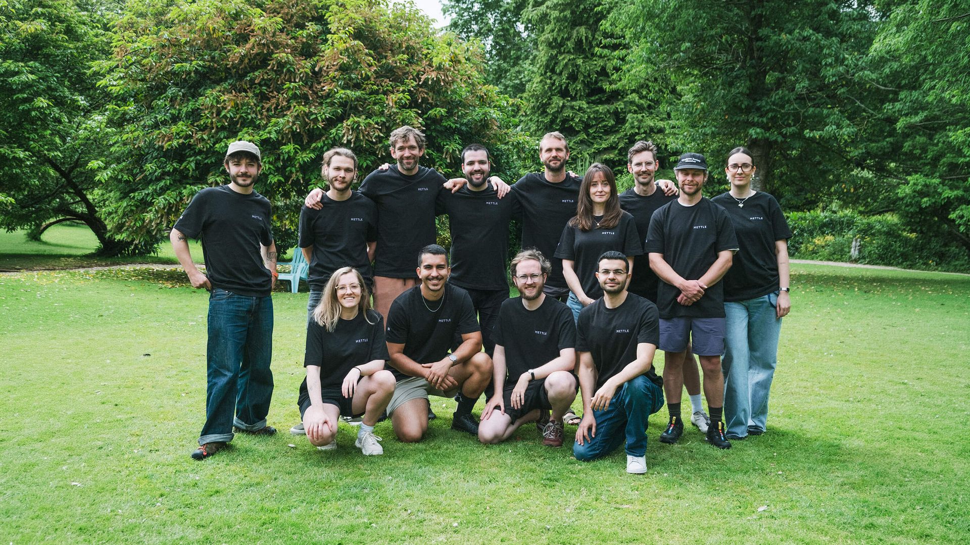The full Mettle team together on a lawn in Devon