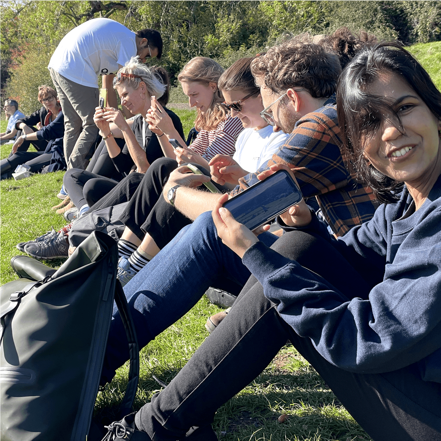 Member of the team showing a picture that they took from a nice view