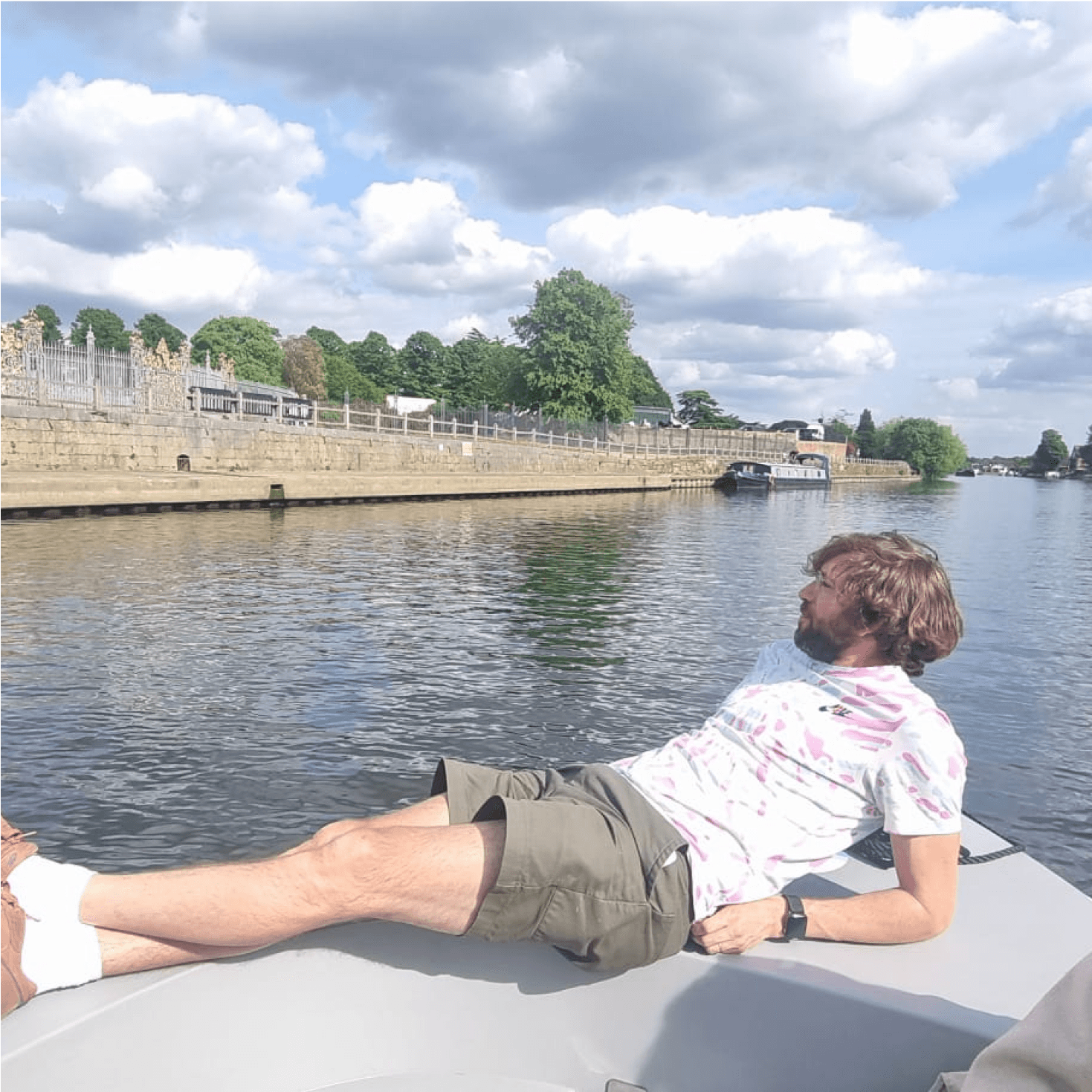 Member of the team inside a boat in the middle of a river