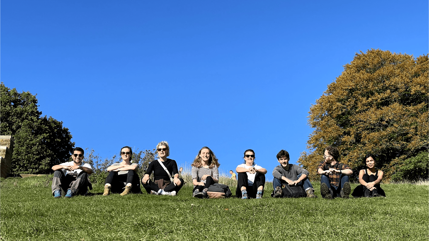 Team on green field